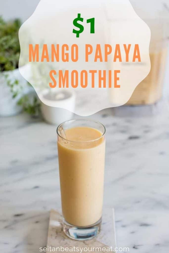 Mango smoothie on marble counter with text "$1 Mango Papaya Smoothie"