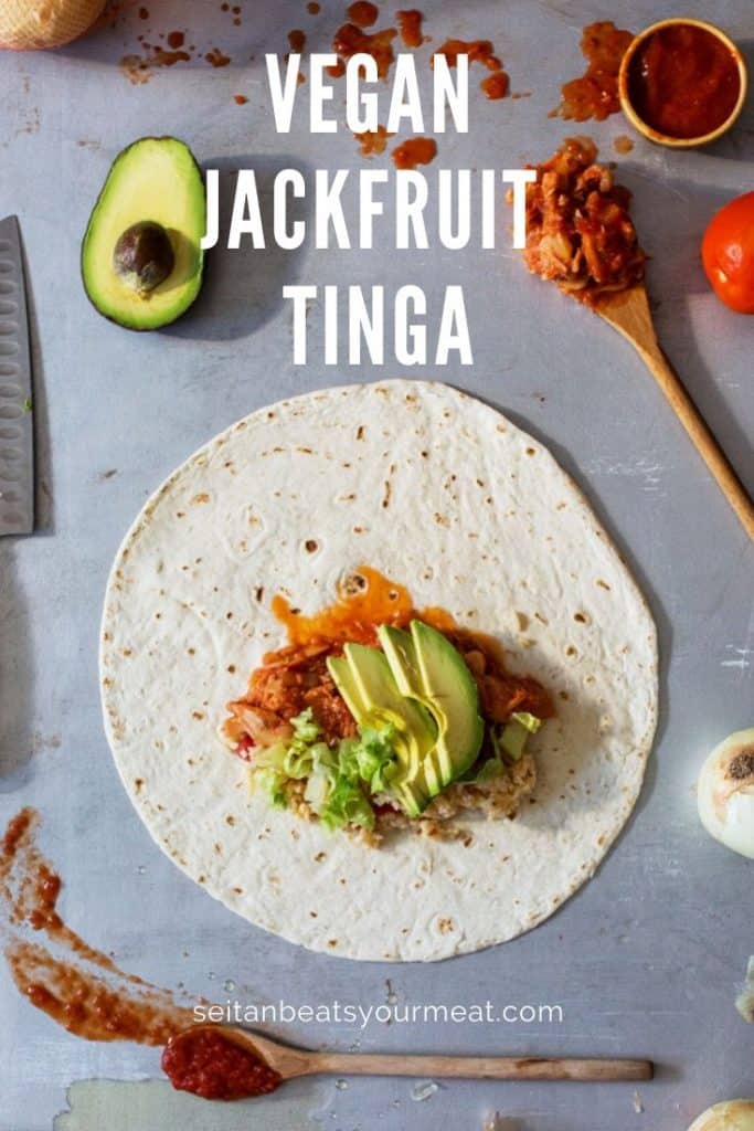 Tortilla with jackfruit tinga and avocado surrounded by the recipe ingredients