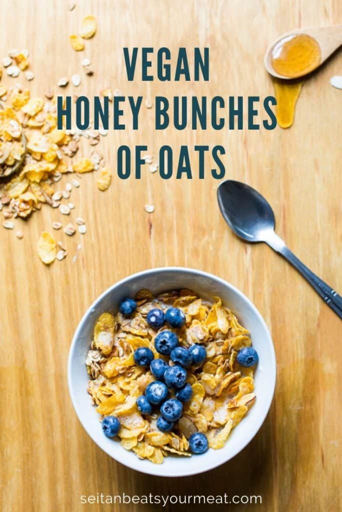 Bowl of vegan Honey Bunches of Oats cereal in bowl with blueberries on a wooden counter