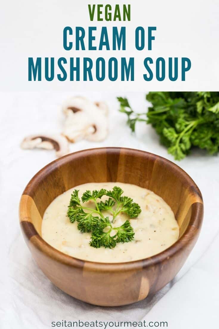 Cream of mushroom soup in a wooden bowl with text "Vegan Cream of Mushroom Soup"