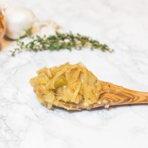 Caramelized onions on wooden spoon