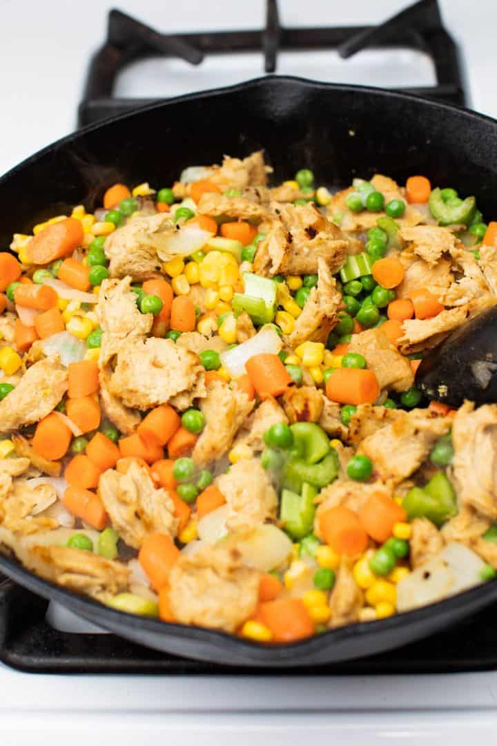 Vegetables and seitan in cast iron pan