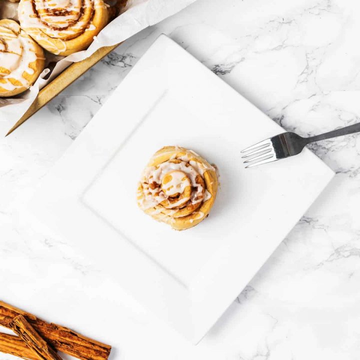 Cinnamon roll on plate with fork