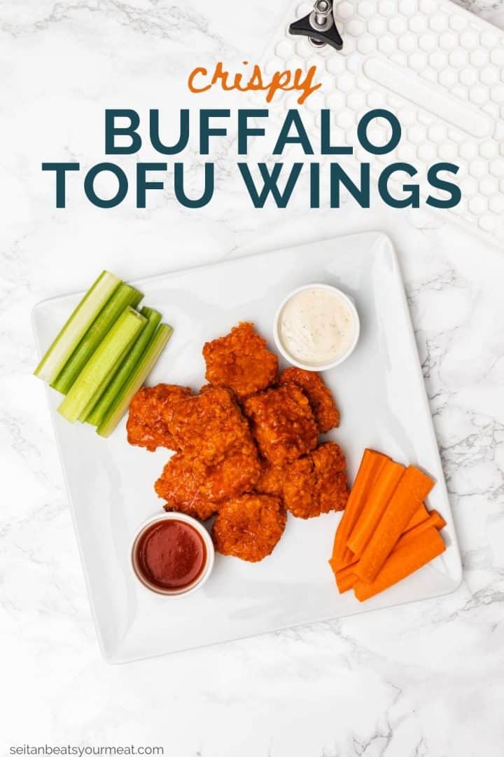 Plate of tofu buffalo wings on plate with carrot and celery sticks with text "Crispy Buffalo Tofu Wings"