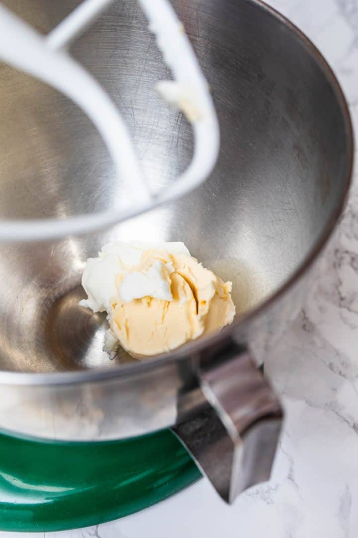 Vegetable shortening and margarine in stand mixer bowl on counter