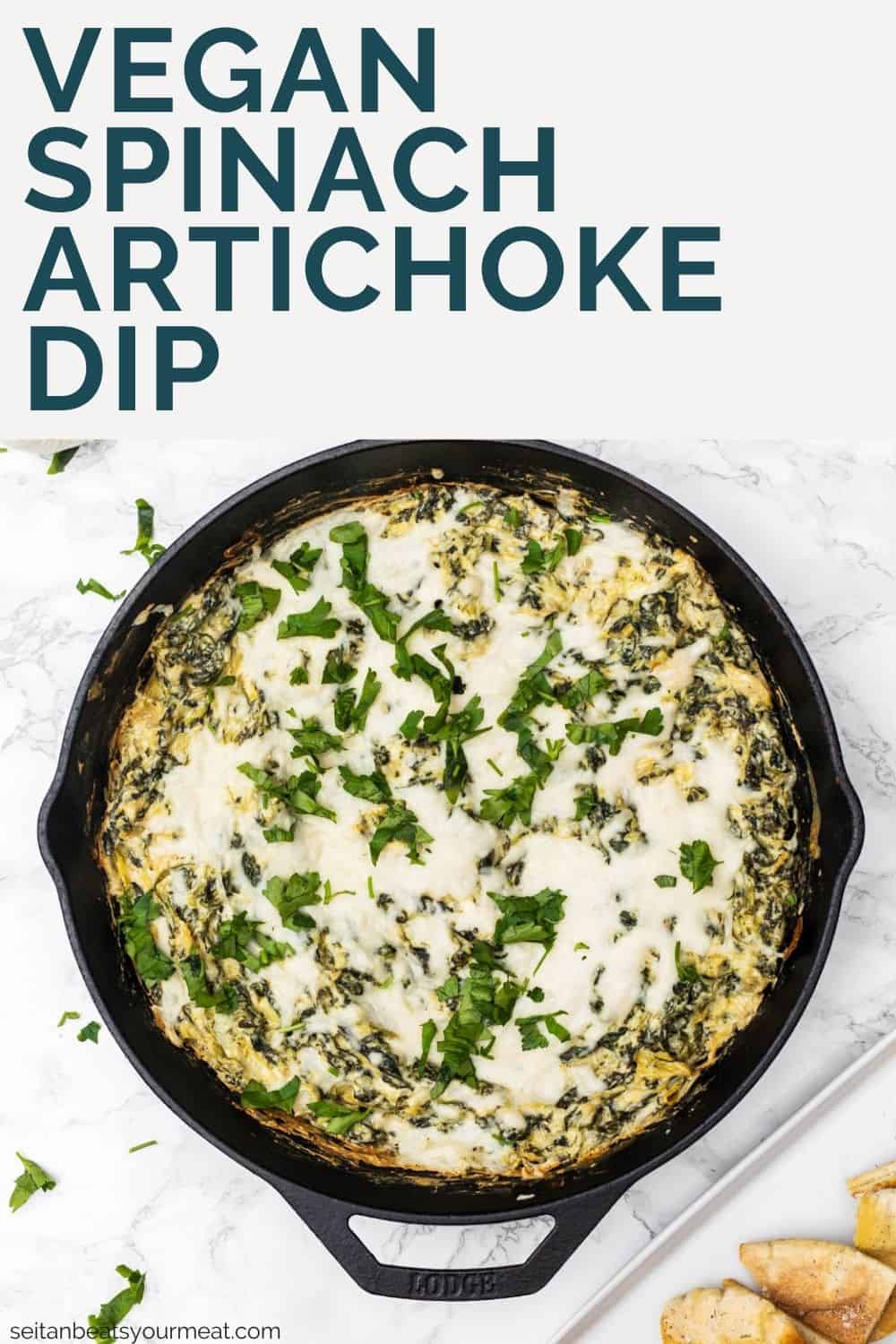 Baked spinach artichoke dip in cast iron pan with text overlay "Vegan Spinach Artichoke Dip"